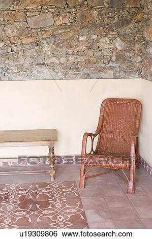 Chair and a table in a living room View Large Photo Image Stock Photograph - Chair and a table in a living room. Fotosearch