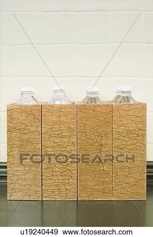 Stock Photo - Close-up of bottles in cartons in a row. Fotosearch