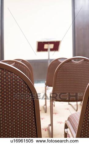 Stock Photography - Close-up of empty chairs in a conference room. Fotosearch