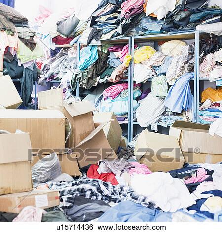 Clothes and cardboard boxes in a factory View Large Photo Image Stock Photograph - Clothes and cardboard boxes in a factory. Fotosearch