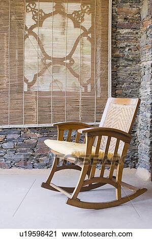 Stock Image - Cushion on a rocking chair. Fotosearch
