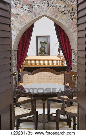 Empty chairs and a table in a hotel room View Large Photo Image Stock Photography - Empty chairs and a table in a hotel room. Fotosearch