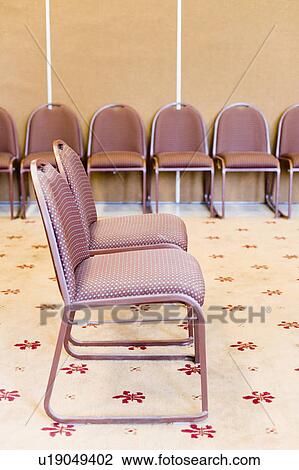 Empty chairs in a conference room View Large Photo Image Stock Image - Empty chairs in a conference room. Fotosearch