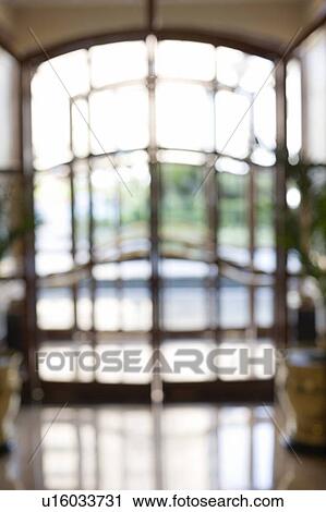Stock Image - Glass door of a hotel. Fotosearch