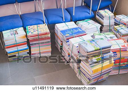 High angle view of stacks of books beside chairs View Large Photo Image Stock Photo - High angle view of stacks of books beside chairs. Fotosearch