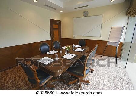 Interiors of an empty conference room View Large Photo Image Stock Image - Interiors of an empty conference room. Fotosearch