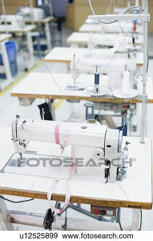 Sewing machines in a factory View Large Photo Image Stock Photo - Sewing machines in a factory. Fotosearch