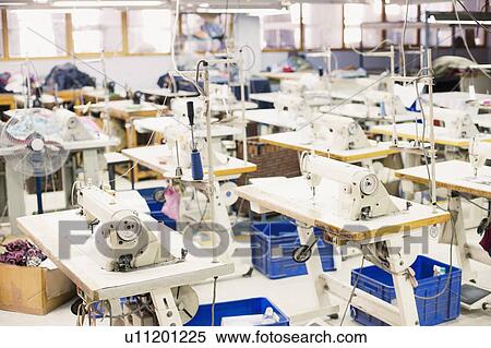 Sewing machines in a factory View Large Photo Image Stock Photography - Sewing machines in a factory. Fotosearch