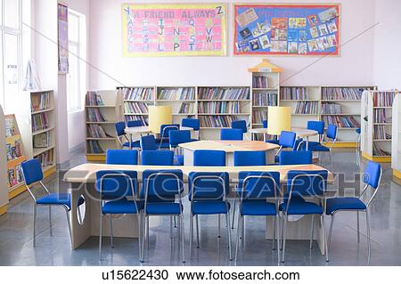 Stock Image - Table and chairs in a library. Fotosearch