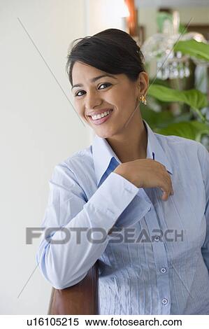 Portrait of a young woman smiling View Large Photo Image Stock Photography - Portrait of a young woman smiling. Fotosearch