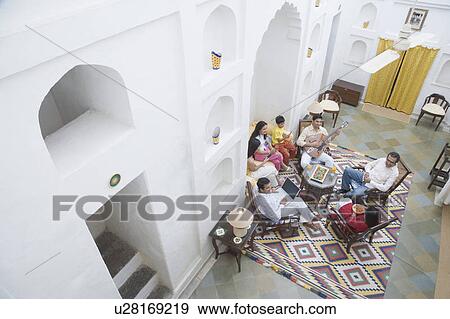 High angle view of a group of people sitting together View Large Photo Image Stock Photo - High angle view of a group of people sitting together. Fotosearch