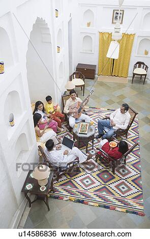 Stock Photograph - High angle view of a group of people sitting together. Fotosearch