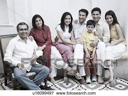 Portrait of a group of people sitting together and smiling View Large Photo Image Stock Photo - Portrait of a group of people sitting together and smiling. Fotosearch