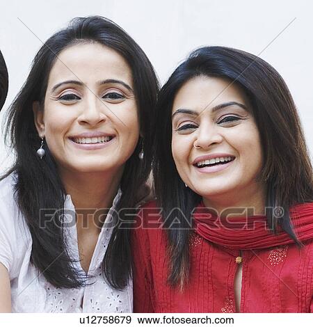 Portrait of two mid adult women smiling View Large Photo Image Stock Photo - Portrait of two mid adult women smiling. Fotosearch