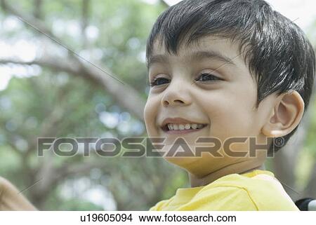 Picture - Close-up of a boy smiling . Fotosearch