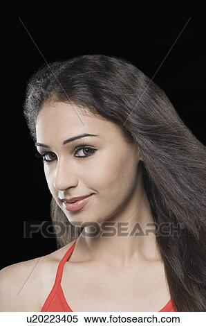 Portrait of a young woman smirking View Large Photo Image Stock Photography - Portrait of a young woman smirking. Fotosearch