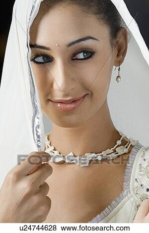 Stock Photo - Close-up of a young woman in lehenga choli. Fotosearch