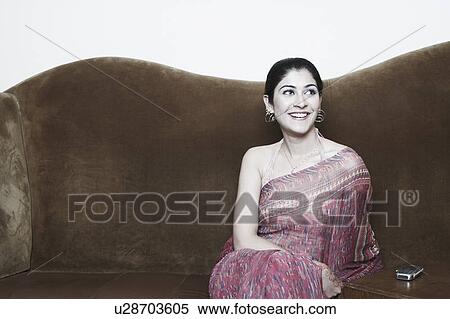 Close-up of a young woman smiling View Large Photo Image Stock Photography - Close-up of a young woman smiling. Fotosearch