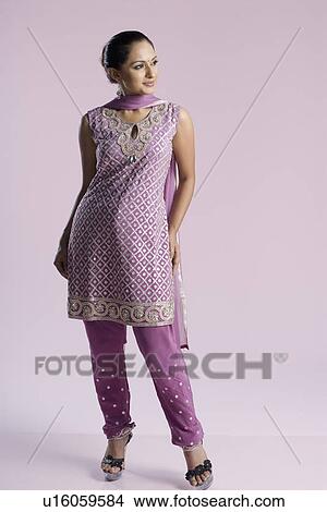 Mid adult woman standing in salwar kameez View Large Photo Image Picture - Mid adult woman standing in salwar kameez. Fotosearch