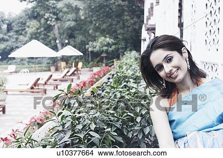 Portrait of a young woman smiling View Large Photo Image Picture - Portrait of a young woman smiling. Fotosearch