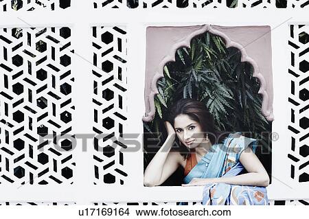 Picture - Portrait of a young woman thinking. Fotosearch