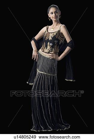 Stock Photo - Young woman standing in lehenga choli. Fotosearch