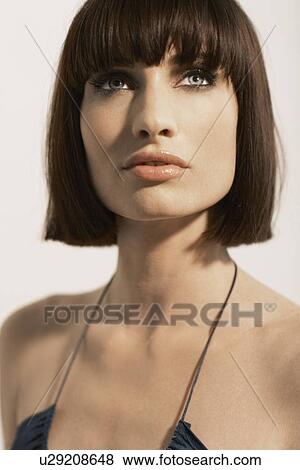 Stock Photo - Mid adult woman with mid length hair. Fotosearch