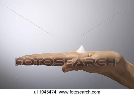 Moisturizer on woman's hand, close-up View Large Photo Image Picture - Moisturizer on woman's hand, close-up. Fotosearch