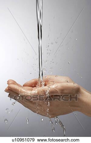 Water pouring on hands, close-up View Large Photo Image Stock Photo - Water pouring on hands, close-up. Fotosearch