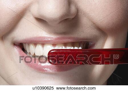 Woman brushing teeth, close-up View Large Photo Image Stock Photography - Woman brushing teeth, close-up. Fotosearch