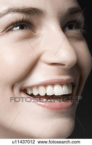 Young woman laughing, close-up View Large Photo Image Stock Image - Young woman laughing, close-up. Fotosearch