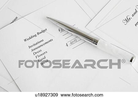 Pen on wedding budget plan (close-up) View Large Photo Image Stock Photo - Pen on wedding budget plan (close-up). Fotosearch