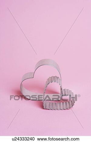 Two heart shaped cookie cutters View Large Photo Image Stock Image - Two heart shaped cookie cutters. Fotosearch