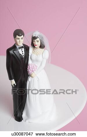 Stock Photo - Wedding cake figurines. Fotosearch