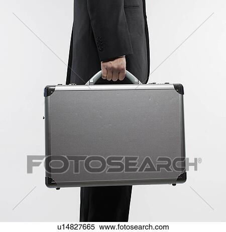 Stock Photography - Businessman Carrying Briefcase. Fotosearch