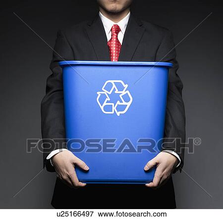 Stock Photo - Businessman Holding Recycling Bin. Fotosearch