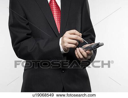 Businessman Using PDA View Large Photo Image Stock Photo - Businessman Using PDA. Fotosearch