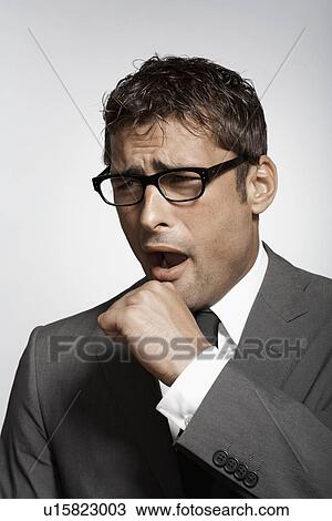 Stock Image - Businessman yawning. Fotosearch