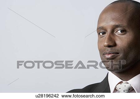 Stock Image - Portrait of mid adult businessman. Fotosearch