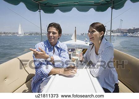 Young adult couple on a cruiser having wine, Side View View Large Photo Image Stock Image - Young adult couple on a cruiser having wine, Side View. Fotosearch