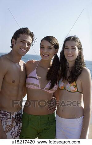Young adult people in swimming wears smiling, Front View, Differential Focus View Large Photo Image Stock Image - Young adult people in swimming wears smiling, Front View, Differential Focus. Fotosearch