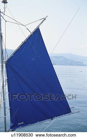 Stock Image - A Blue Flag And The Sea. Fotosearch
