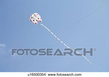 Picture - A Blue Sky And A Kite. Fotosearch