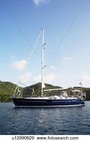 Mid adult couple on sailboat View Large Photo Image Stock Photo - Mid adult couple on sailboat. Fotosearch