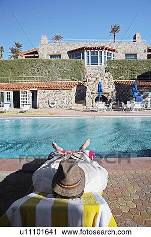 Mid Adult Man Lying at Poolside View Large Photo Image Stock Image - Mid Adult Man Lying at Poolside. Fotosearch