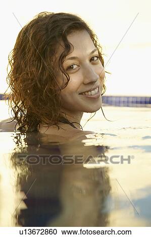 Mid adult woman in water (portrait) View Large Photo Image Stock Image - Mid adult woman in water (portrait). Fotosearch