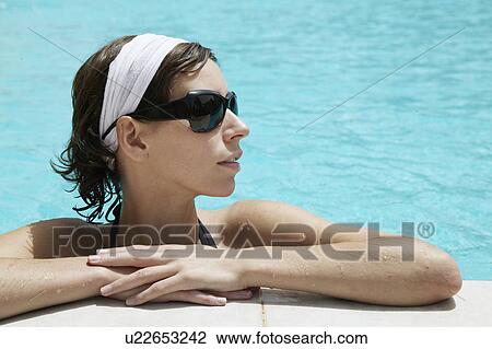 Stock Image - Woman in Swimming Pool. Fotosearch
