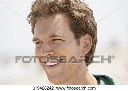 Young man smiling View Large Photo Image Stock Image - Young man smiling. Fotosearch