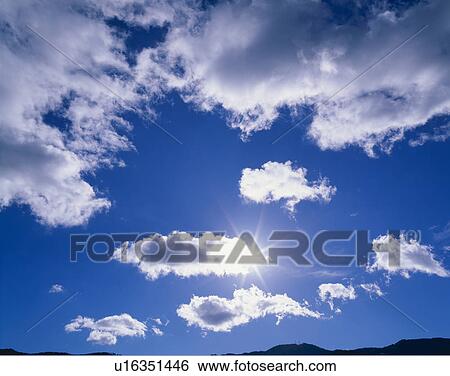 Stock Photograph - Sun And Clouds. Fotosearch