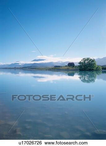 Stock Photograph - Mountains Reflected In Lake. Fotosearch